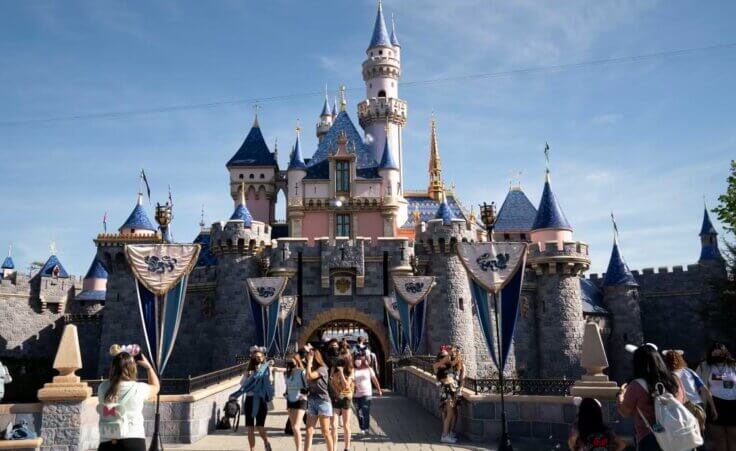 FILE - In this Friday, April 30, 2021, file photo, visitors exit The Sleeping Beauty Castle at Disneyland in Anaheim, Calif. (AP Photo/Jae C. Hong, File). The Walt Disney Company recently announced Pride Nite.