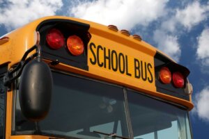 Close-up of the top front of a school bus. © By Julianna Olah/stock.adobe.com | A Michigan seventh grader recently took control of his school bus after the driver lost consciousness.