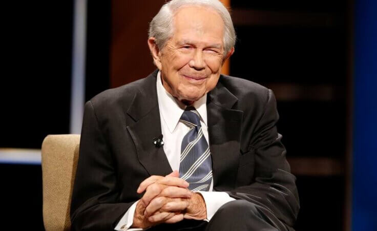 FILE - Rev. Pat Robertson poses a question to a Republican presidential candidate during a forum at Regent University in Virginia Beach, Va., Oct. 23, 2015. Robertson, a religious broadcaster who turned a tiny Virginia station into the global Christian Broadcasting Network, tried a run for president and helped make religion central to Republican Party politics in America through his Christian Coalition, has died. He was 93. Robertson's death Thursday, June 8, 2023 was announced by his broadcasting network. (AP Photo/Steve Helber, File)