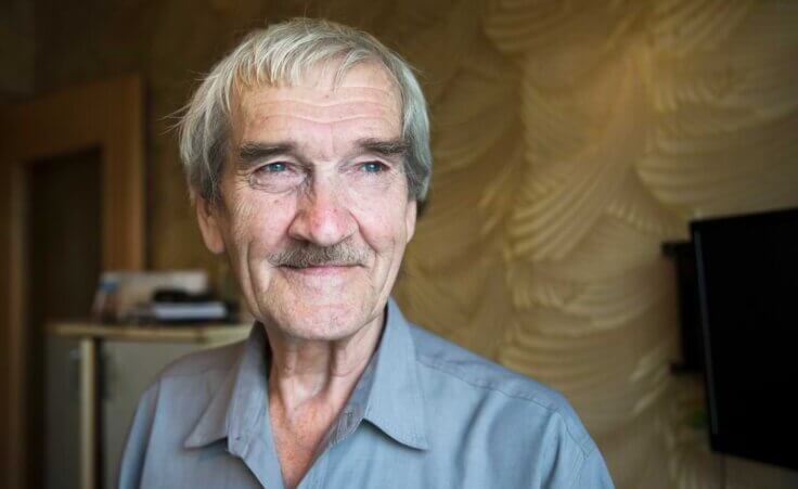 FILE In this file photo taken on Thursday, Aug. 27, 2015, former Soviet missile defense forces officer Stanislav Petrov poses for a photo at his home in Fryazino, Moscow region, Russia. Petrov, a former Soviet military officer, is known in the West as "The man who saved the world'' for his role in averting a nuclear war over a false missile alarm. (AP Photo/Pavel Golovkin)
