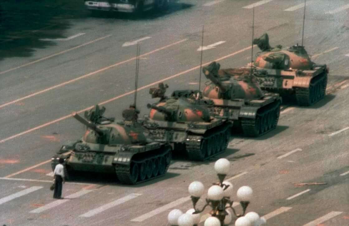 FILE - In this June 5, 1989, file photo, a Chinese man stands alone to block a line of tanks heading east on Beijing's Changan Blvd. in Tiananmen Square. (AP Photo/Jeff Widener, File). The 34th anniversary of the Tiananmen Square massacre was June 4, 2023.