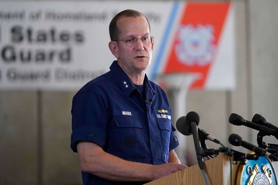 U.S. Coast Guard Rear Adm. John Mauger, commander of the First Coast Guard District, speaks to the media, Monday, June 19, 2023, in Boston. A search is underway for a missing submersible that carries people to view the wreckage of the Titanic. Canadian officials say the five-person submersible was reported overdue Sunday night about 435 miles (700 kilometers) south of St. John's, Newfoundland and that the search is being led by the U.S. Coast Guard. (AP Photo/Steven Senne)