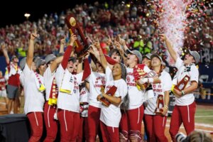 Oklahoma players celebrate with the trophy after defeating Florida State in the NCAA Women's College World Series championship series, Thursday, June 8, 2023, in Oklahoma City. (AP Photo/Nate Billings). The OU softball team has also made headlines for its Christian witness.