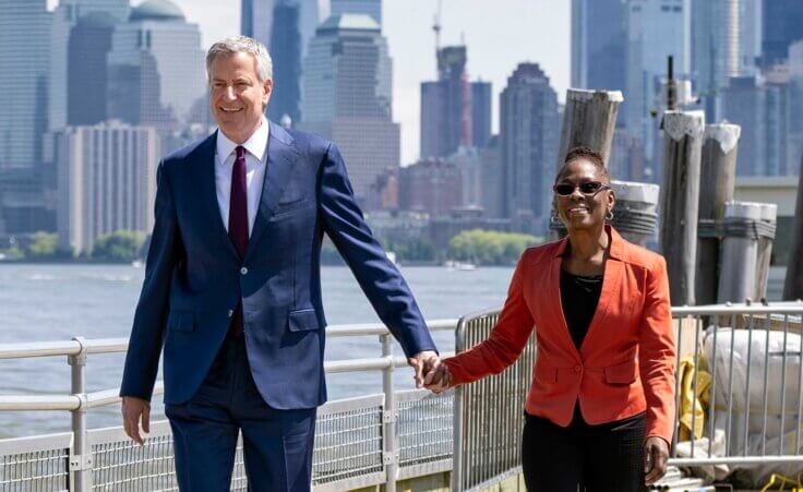 FILE - New York City Mayor Bill de Blasio and his wife Chirlane McCray arrive for the official dedication ceremony of the Statue of Liberty Museum on Liberty Island, May 16, 2019, in New York. Former New York CIty Mayor de Blasio and McCray are separating but not divorcing after 29 years of a marriage that helped lift de Blasio into the mayor's job. (AP Photo/Craig Ruttle, File)
