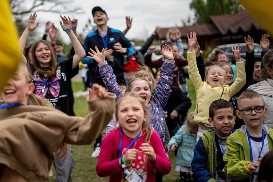 Children dance at the recovery camp for children and their mothers affected by the war near Lviv, Ukraine, Wednesday, May 3, 2023. A generation of Ukrainian children have seen their lives upended by Russia's invasion of their country. Hundreds of kids have been killed. For the survivors, the wide-ranging trauma is certain to leave psychological scars that will follow them into adolescence and adulthood. UNICEF says an estimated 1.5 million Ukrainian children are at risk of mental health issues. (AP Photo/Hanna Arhirova)
