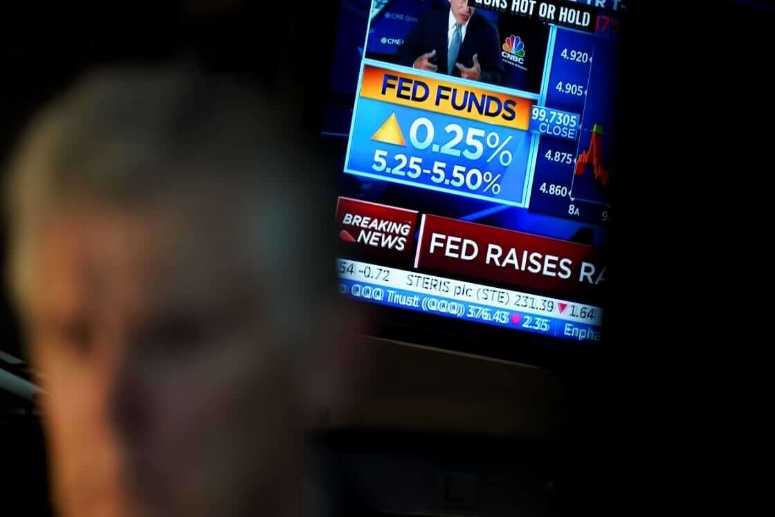 A monitor displays the raise in the interest rate on the floor at the New York Stock Exchange in New York, Wednesday, July 26, 2023. Stocks are mixed after the Federal Reserve followed through on Wall Street's expectations and raised its benchmark interest rate to its highest level in more than two decades (AP Photo/Seth Wenig). Consequently, many are wondering if a recession is coming.