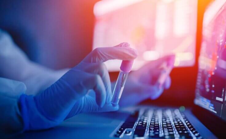 A lab technician wearing blue gloves holds a vial of some chemical substance in front of an open laptop. © Parilov/stock.adobe.com Authorities discovered an unlicensed lab in Fresno County, California, where the CDC found at least twenty potentially infectious agents.