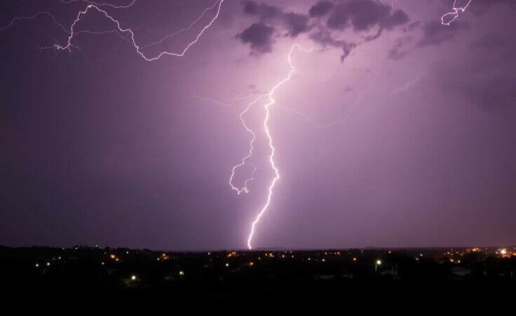 Cloud-to-ground lightning strikes the earth above a country town at night. © By bellass/stock.adobe.com. When the storms of life strike, where do you turn?