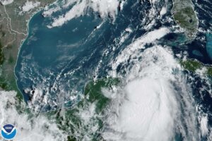 In this Monday, Aug. 28, 2023, 9:41 am ET satellite image provided by the National Oceanic and Atmospheric Administration, Tropical Storm Idalia moves between Mexico's Yucatan peninsula, left, and Cuba, right. Idalia intensified early Monday and was expected to become a major hurricane before it reaches Florida's Gulf coast, according to the National Hurricane Center. (NOAA via AP)