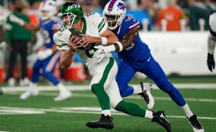 New York Jets quarterback Aaron Rodgers (8) is sacked by Buffalo Bills defensive end Leonard Floyd (56) during the first quarter of an NFL football game, Monday, Sept. 11, 2023, in East Rutherford, N.J. (AP Photo/Seth Wenig)