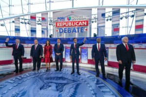 Republican presidential candidates, from left, North Dakota Gov. Doug Burgum, former New Jersey Gov. Chris Christie, former U.N. Ambassador Nikki Haley, Florida Gov. Ron DeSantis, entrepreneur Vivek Ramaswamy, Sen. Tim Scott, R-S.C., and former Vice President Mike Pence, before the start of a Republican presidential primary debate hosted by FOX Business Network and Univision, Wednesday, Sept. 27, 2023, at the Ronald Reagan Presidential Library in Simi Valley, Calif. (AP Photo/Mark Terrill)