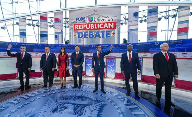 Republican presidential candidates, from left, North Dakota Gov. Doug Burgum, former New Jersey Gov. Chris Christie, former U.N. Ambassador Nikki Haley, Florida Gov. Ron DeSantis, entrepreneur Vivek Ramaswamy, Sen. Tim Scott, R-S.C., and former Vice President Mike Pence, before the start of a Republican presidential primary debate hosted by FOX Business Network and Univision, Wednesday, Sept. 27, 2023, at the Ronald Reagan Presidential Library in Simi Valley, Calif. (AP Photo/Mark Terrill)