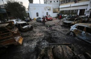 Palestinians check the place of the explosion at al-Ahli hospital, in Gaza City, Wednesday, Oct. 18, 2023. The Hamas-run Health Ministry says an Israeli airstrike caused the explosion that killed hundreds at al-Ahli, but the Israeli military says it was a misfired Palestinian rocket. (AP Photo/Abed Khaled)