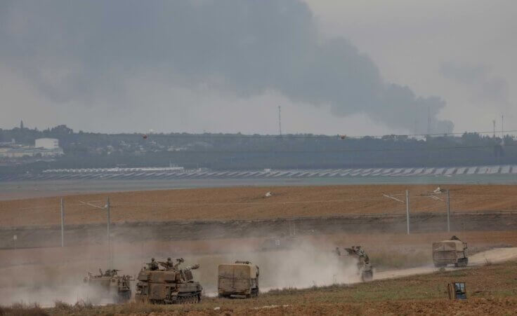 Israeli army vehicles move near the Israeli-Gaza border, southern Israel, Monday, Oct. 9, 2023 (AP Photo/Oren Ziv). Days earlier, former Israeli paratrooper Israel Ziv, 61, joined the fight of his own accord when Hamas attacked Israel on October 7.