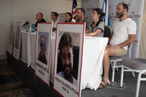 FILE - Relatives of U.S. citizens that are missing since Saturday's surprise attack by Hamas militants near the Gaza border, attend a news conference on Oct. 10, 2023 in Tel Aviv, Israel. Seated from left: Jonathan Dekel-Chen, father of Sagui Dekel-Chen (35) from Nahal Oz; Ruby Chen, father of Itay Chen, 19, a soldier in the armored corps; Ayala Neta, daughter, and Nahal Neta, son of Adrienne Neta, 66, a nurse living in Kibbitz Be'eri; Rachel Goldberg, mother of Hersh Goldberg-Polin, 23, and Jonathan Polin, Hersh's father. Hersh was last seen when Hamas militants loaded him into the back of a pickup truck with other hostages abducted from a trance music festival in the western Negev Desert on Oct. 7. His mother, Rachel Goldberg, expects to see him again. (AP Photo/Maya Alleruzzo, File)