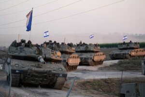 Israeli tanks head towards the Gaza Strip border in southern Israel on Thursday, Oct.12, 2023. (AP Photo/Ohad Zwigenberg)