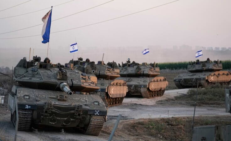 Israeli tanks head towards the Gaza Strip border in southern Israel on Thursday, Oct.12, 2023. (AP Photo/Ohad Zwigenberg)