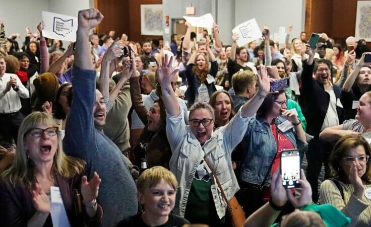 Issue 1 supporters cheer as they watch election results come in, Tuesday, Nov. 7, 2023, in Columbus Ohio. Ohio voters have approved a constitutional amendment that guarantees the right to abortion and other forms of reproductive health care. The outcome of Tuesday’s intense, off-year election was the latest blow for abortion opponents. (AP Photo/Sue Ogrocki)