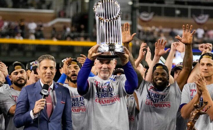 Texas Rangers manager Bruce Bochy holds up the trophy after Game 5 of the baseball World Series against the Arizona Diamondbacks Wednesday, Nov. 1, 2023, in Phoenix. The Rangers won 5-0 to win the series 4-1. (AP Photo/Brynn Anderson)