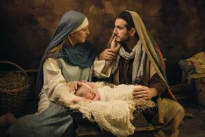 Mary looks at Joseph as they sit behind the baby Jesus in a manger in a live nativity scene. By Anneke/stock.adobe.com. In stark contrast, a Satanic display was recently placed—and then torn down—at the Iowa capitol building.