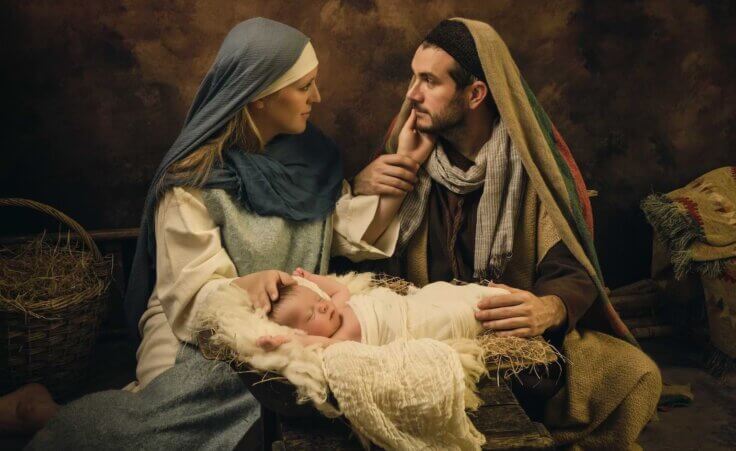 Mary looks at Joseph as they sit behind the baby Jesus in a manger in a live nativity scene. By Anneke/stock.adobe.com. In stark contrast, a Satanic display was recently placed—and then torn down—at the Iowa capitol building.