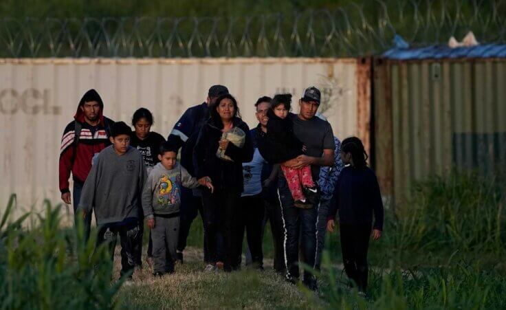 Migrants walk past a barrier after they crossed the Rio Grande and entered the U.S. from Mexico, Thursday, Oct. 19, 2023, in Eagle Pass, Texas. (AP Photo/Eric Gay) Such an immigration crisis is a complex issue.