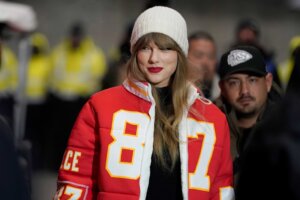 FILE - Taylor Swift wears a Kansas City Chiefs tight end Travis Kelce jacket as she arrives before an NFL wild-card playoff football game between the Chiefs and the Miami Dolphins, Saturday, Jan. 13, 2024, in Kansas City, Mo. A scourge of pornographic deepfake images generated by artificial intelligence and sexualizing people without their consent has hit its most famous victim, singer Taylor Swift, drawing attention to a problem that tech platforms and anti-abuse groups have struggled to solve. (AP Photo/Ed Zurga, File)