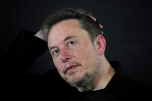 FILE - Elon Musk appears at an event with Britain's Prime Minister Rishi Sunak in London, on Nov. 2, 2023. According to Musk, the first human received an implant from his computer-brain interface company Neuralink over the weekend. (AP Photo/Kirsty Wigglesworth, Pool, File)