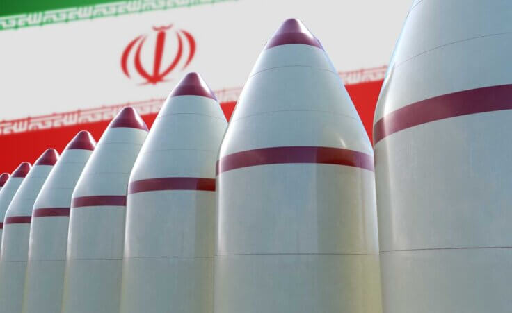 A 3D rendering of eight white-and-red missiles in front of an Iranian flag, illustrating Iran's growing nuclear capabilities. By vchalup/stock.adobe.com