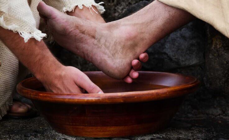 Jesus washes a person's foot. The Super Bowl "He Gets Us" commercial message showed Christians washing the feet of others. By Laci Gibbs/stock.adobe.com