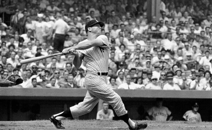 New York Yankees center fielder Mickey Mantle completes his swing as he hits his 49th home run of the season in the first inning against the Detroit Tigers at Yankee Stadium, Bronx, New York, September 3, 1961. The home run came with Mickey's teammate and home run rival Roger Maris, on base. ( AP Photo )