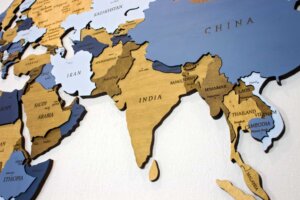 The country of India is centered on a wooden map. Religious persecution in India is rising. By Александра Замулина/stock.adobe.com