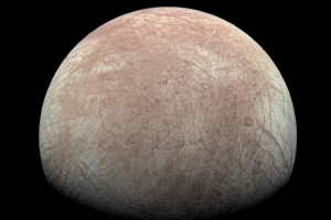 This image provided by NASA, processed by Kevin M. Gill, shows Jupiter's moon Europa captured by the Juno spacecraft on Sept. 29, 2022, with north to the left. Research published Monday, March 4, 2024, suggests there's less oxygen on the icy surface of Jupiter's moon Europa than thought — and that could affect what if any life might be lurking in the moon’s underground ocean. (Kevin M. Gill/NASA/JPL-Caltech/SwRI via AP)