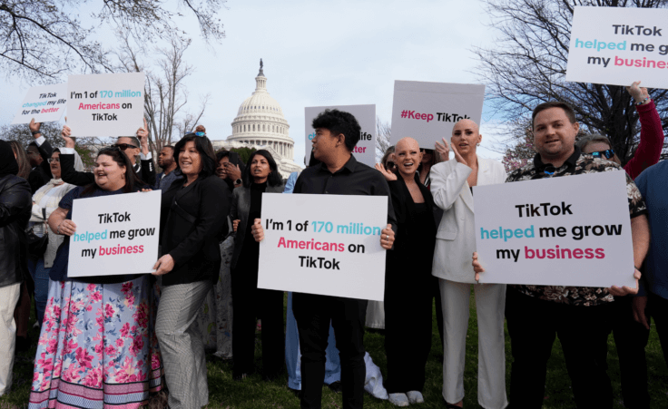 Devotees of TikTok gather at the Capitol in Washington, as the House passed a bill that would lead to a nationwide ban of the popular video app if its China-based owner doesn't sell, Wednesday, March 13, 2024. Lawmakers contend the app's owner, ByteDance, is beholden to the Chinese government, which could demand access to the data of TikTok's consumers in the U.S. (AP Photo/J. Scott Applewhite)