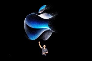 File - Apple CEO Tim Cook waves at an announcement of new products on Sept. 12, 2023, in Cupertino, Calif. (AP Photo/Jeff Chiu, File)