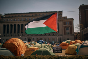A Palestinian flag flutters in the wind during a pro-Palestinian protest encampment, advocating for financial disclosure and divestment from all companies tied to Israel and calling for a permanent cease-fire in Gaza, inside Columbia University Campus on Sunday, April 28, 2024, in New York. (AP Photo/Andres Kudacki)