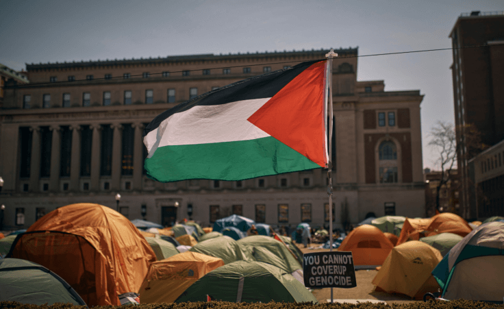 A Palestinian flag flutters in the wind during a pro-Palestinian protest encampment, advocating for financial disclosure and divestment from all companies tied to Israel and calling for a permanent cease-fire in Gaza, inside Columbia University Campus on Sunday, April 28, 2024, in New York. (AP Photo/Andres Kudacki)