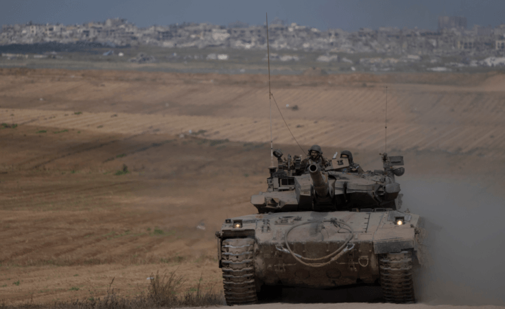 Israeli soldiers move on the top of a tank near the Israeli-Gaza border, as seen from southern Israel, Tuesday, April 9, 2024. (AP Photo/Leo Correa) Why is Israel so happy?