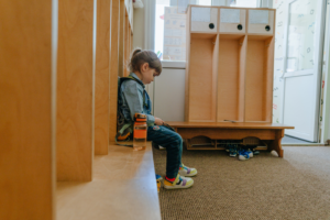 Little girl sitting in a locker room. Title IX expands discrimination to include sexual identity and orientation. Photo by lithiumphoto/stock.adobe.com