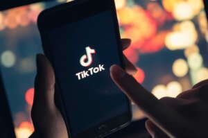TikTok application icon on iPhone. By chathuporn/Stock.Adobe.com