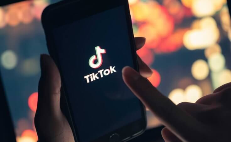 TikTok application icon on iPhone. By chathuporn/Stock.Adobe.com