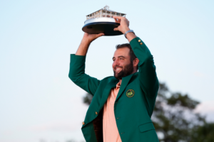 Scottie Scheffler holds the trophy after winning the Masters golf tournament at Augusta National Golf Club Sunday, April 14, 2024, in Augusta, Ga. (AP Photo/Matt Slocum)