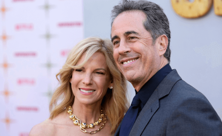 Jerry Seinfeld, right, the writer/director/star of "Unfrosted," poses with his wife Jessica at the premiere of the Netflix film at the Egyptian Theatre, Tuesday, April 30, 2024, in Los Angeles. (AP Photo/Chris Pizzello)