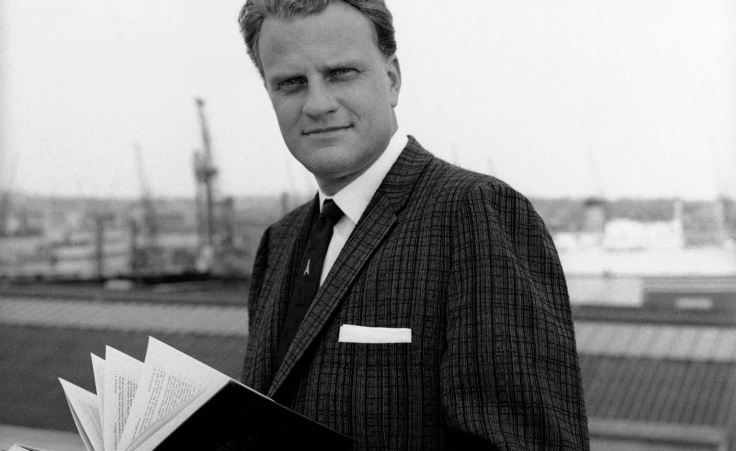 Billy Graham, the famed American evangelist, poses on board the liner Queen Mary on his arrival at Southampton, Hampshire, from New York, May 22, 1961. He is to tour Britain. (AP Photo)
