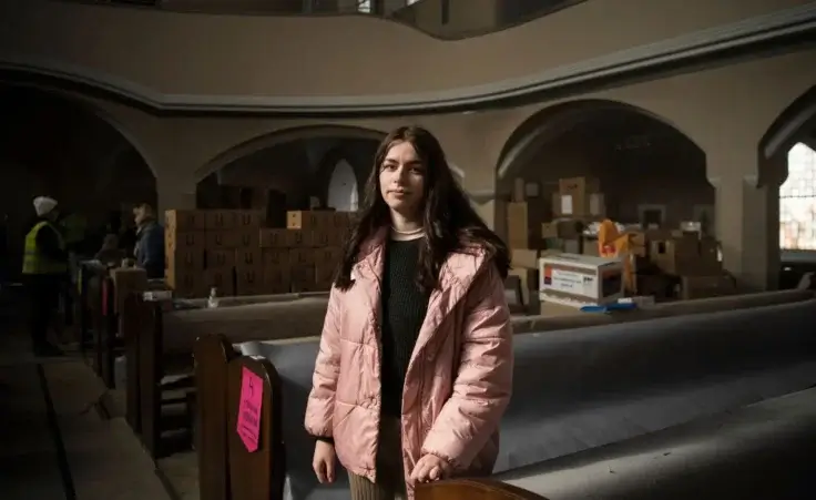 Alone Fartukhova, a student from Ukraine poses for a photo after a church service and prayer for peace in an evangelical church in Berlin, Sunday, March 20, 2022. (AP Photo/Steffi Loos) Russia