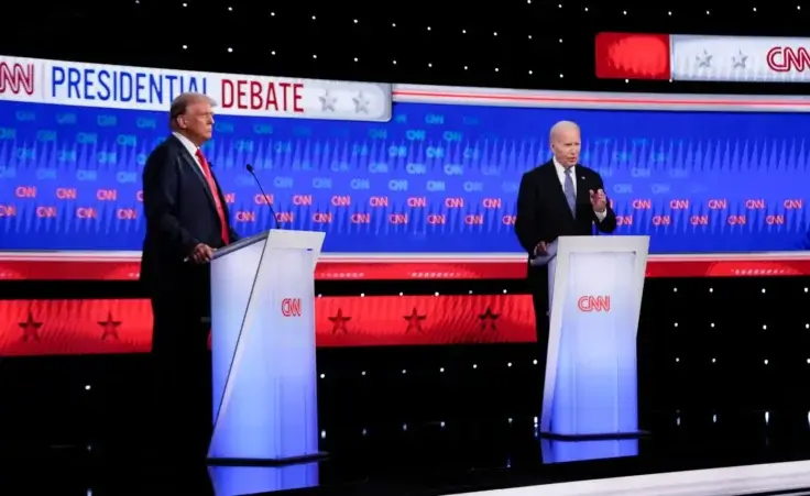 President Joe Biden, right, speaks as Republican presidential candidate former President Donald Trump listens during a presidential debate hosted by CNN, Thursday, June 27, 2024, in Atlanta. (AP Photo/Gerald Herbert)
