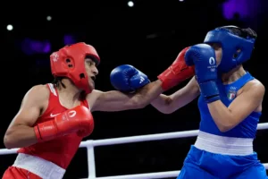 Algeria's Imane Khelif, left, fights Italy's Angela Carini in their women's 66kg preliminary boxing match at the 2024 Summer Olympics, Thursday, Aug. 1, 2024, in Paris, France. (AP Photo/John Locher)