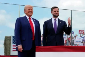 Republican presidential nominee former President Donald Trump and Republican vice presidential nominee Sen. JD Vance, R-Ohio, stand on stage at a campaign rally at North Carolina Aviation Museum, Wednesday, Aug. 21, 2024, in Asheboro, N.C. (AP Photo/Julia Nikhinson)