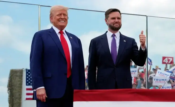 Republican presidential nominee former President Donald Trump and Republican vice presidential nominee Sen. JD Vance, R-Ohio, stand on stage at a campaign rally at North Carolina Aviation Museum, Wednesday, Aug. 21, 2024, in Asheboro, N.C. (AP Photo/Julia Nikhinson)
