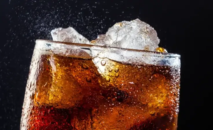 Cola drink in glass with ice. By hansgeel/stock.adobe.com.